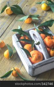 Fresh tangerines in the wooden box