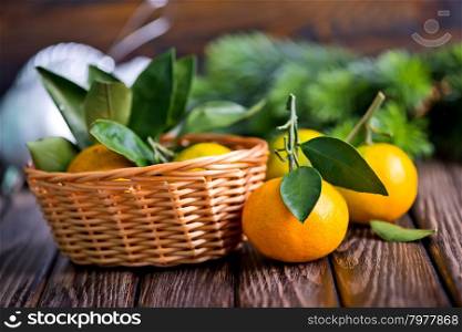 fresh tangerines with christmas decoration on a table