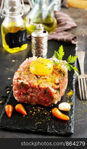 fresh tartar with spice and yolk, meat tartar