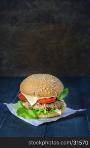 fresh tasty burger . Closeup of home made burgers on wooden background