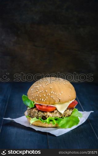 fresh tasty burger . Closeup of home made burgers on wooden background