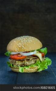fresh tasty burger . Closeup of home made burgers on wooden background