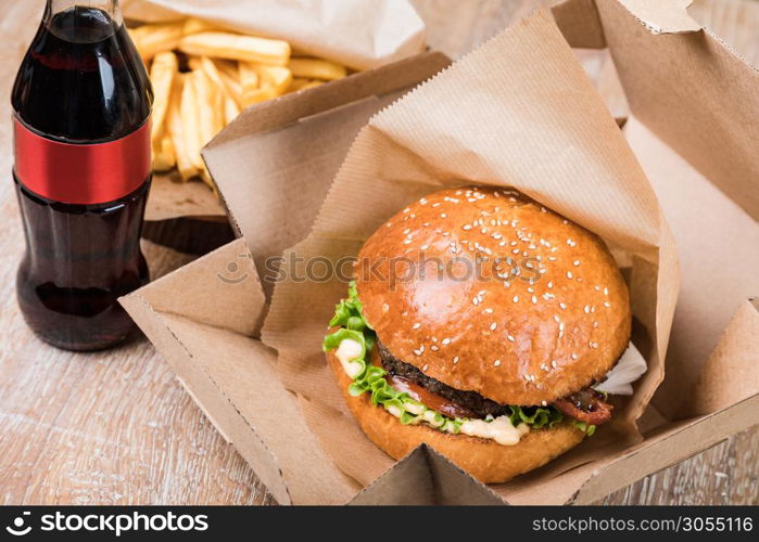 fresh tasty burger on wood table. Burger on a wooden board