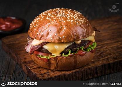 fresh tasty burger on wood table. Burger on a wooden board