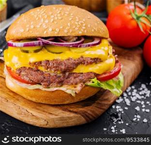 Fresh tasty burger on wooden board