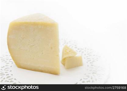 Fresh tasty piece of cheese on white background