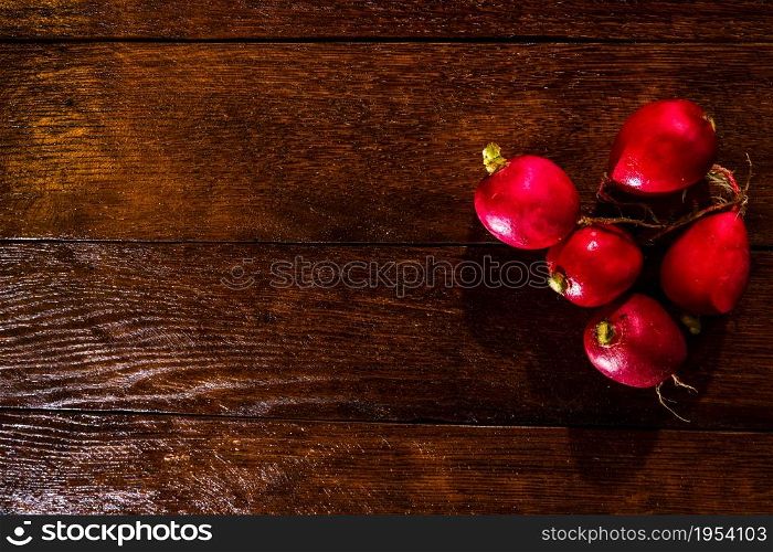 Fresh tasty radishes on cutting board