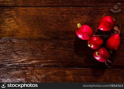 Fresh tasty radishes on cutting board