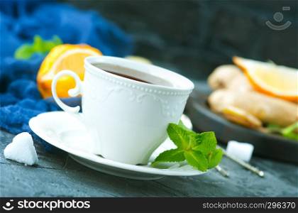 fresh tea in cup and on a table