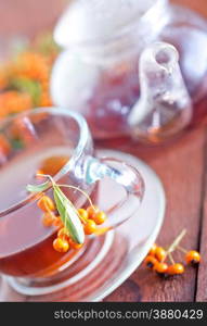 fresh tea in cup and on a table