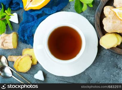 fresh tea in cup and on a table