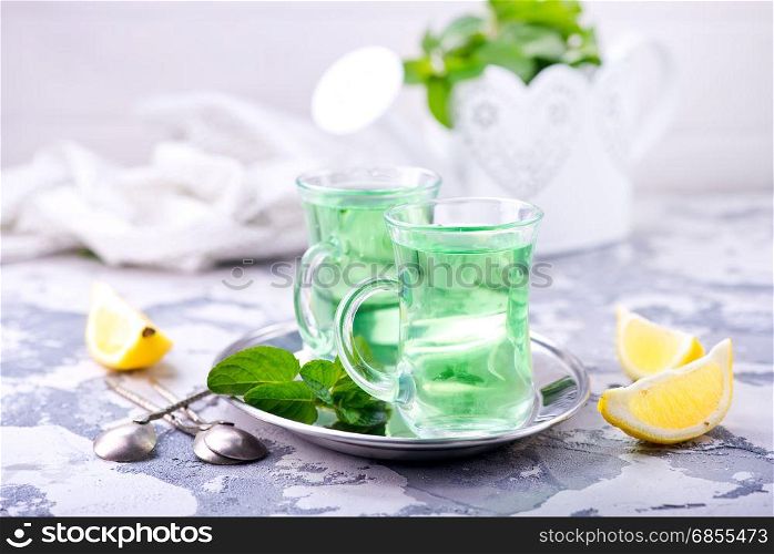 fresh tea in glass cups and on a table