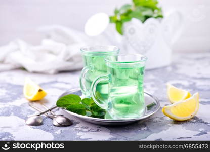 fresh tea in glass cups and on a table