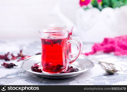 fresh tea in glass cups and on a table