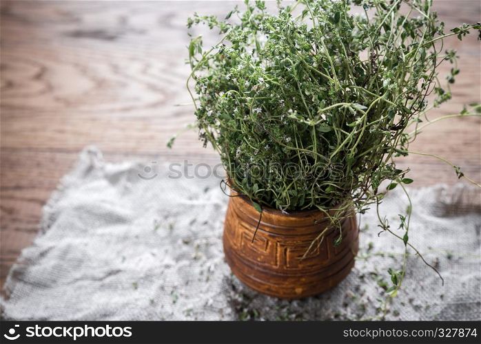 Fresh thyme on the wooden background