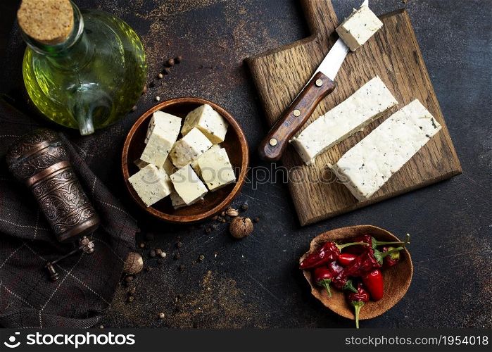 Fresh tofu on board, an alternative to meat protein. Vegetarian cuisine.