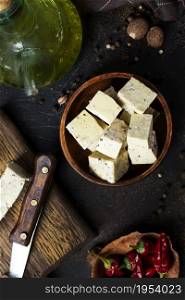 Fresh tofu on board, an alternative to meat protein. Vegetarian cuisine.