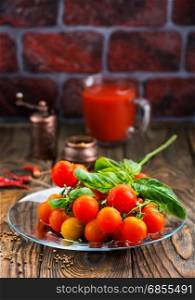 fresh tomato and basil on the wooden table