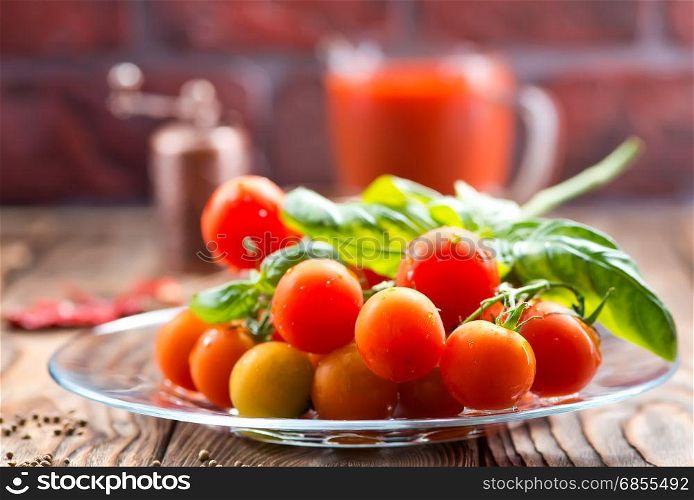 fresh tomato and basil on the wooden table