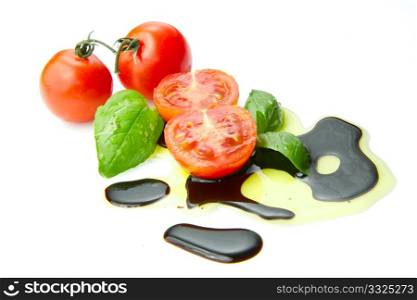Fresh tomato and basil over olive oil and balsamic vinegar