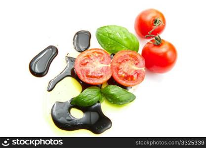 Fresh tomato and basil over olive oil and balsamic vinegar