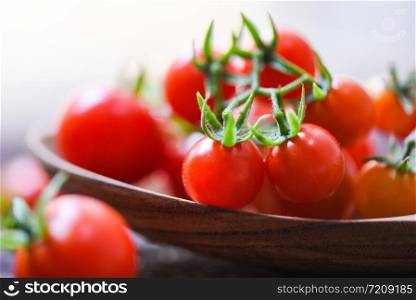 Fresh tomato cherry organic / Close up ripe red tomatoes wooden spoon background - selective focus