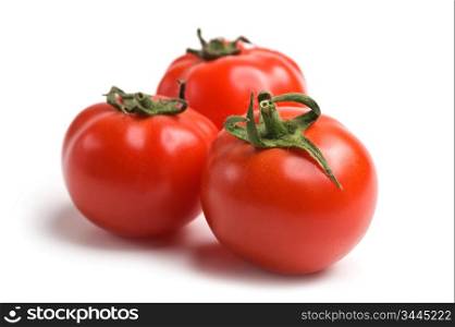 Fresh tomato, isolated on white background Studio photo. Red tomato.
