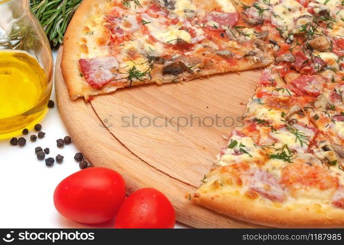 Fresh tomato, mushroom, cheese and sausage pizza on a round board isolated on white background. Fresh tomato, mushroom, cheese and sausage pizza on a round board isolated on white