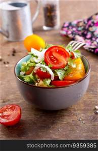 fresh tomato salad on plate and on a table