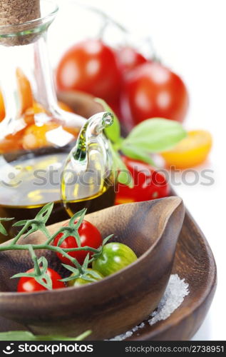 Fresh tomatoes and olive oil over white