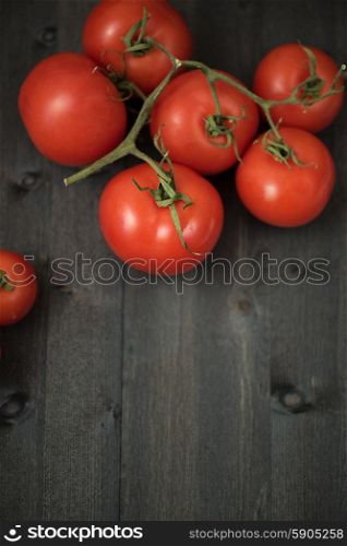 Fresh tomatoes . Fresh tomatoes on vintage wooden table
