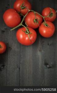 Fresh tomatoes . Fresh tomatoes on vintage wooden table