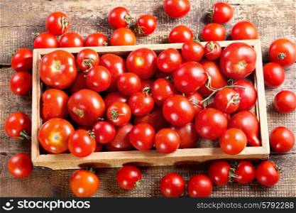 fresh tomatoes in a wooden box