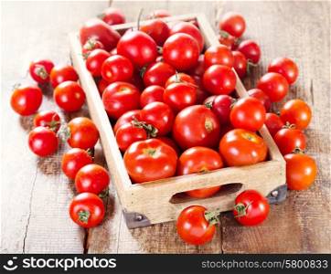 fresh tomatoes in a wooden box
