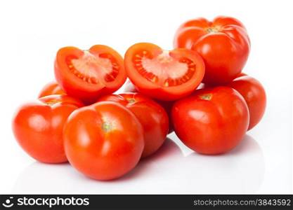 Fresh tomatoes isolated on white. Closeup of tomatoes