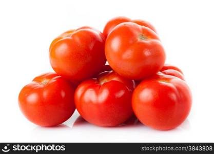 Fresh tomatoes isolated on white. Closeup of tomatoes