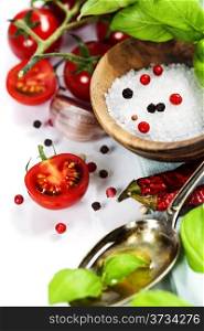 fresh tomatoes, olive oil and basil on white background