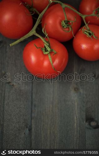Fresh tomatoes on vintage wooden table. Fresh tomatoes