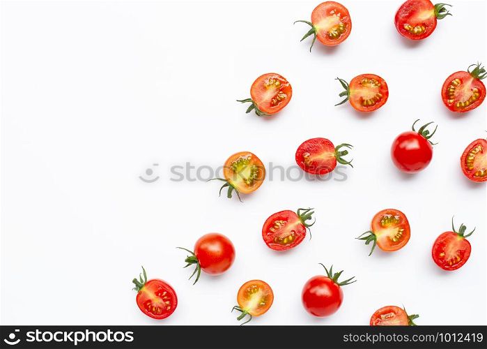 Fresh tomatoes, whole and half cut isolated on white background. Top view