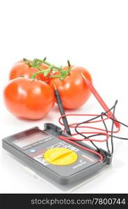 Fresh tomatoes with multimeter
