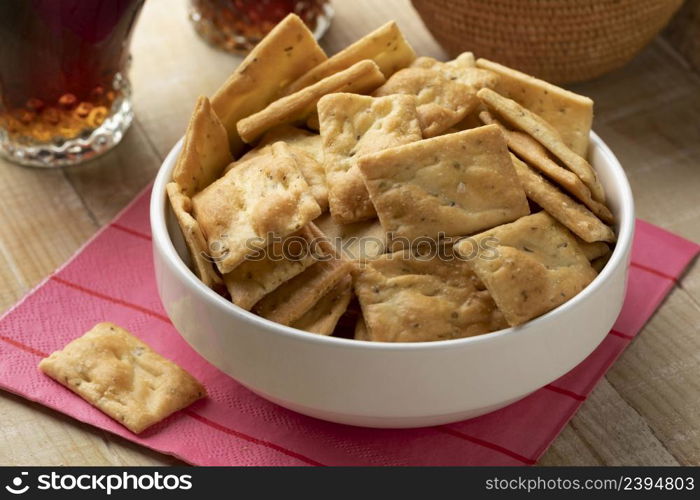 Fresh traditional Italian Scrocchi, rosemary and sea salt crackers, in a bowl close up