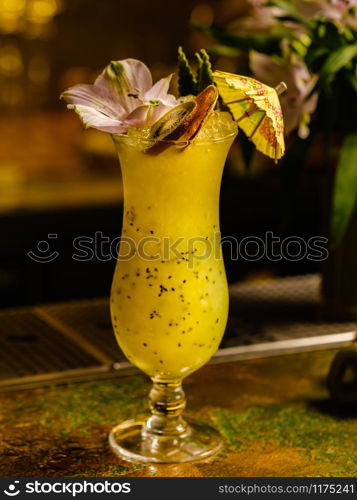 Fresh tropical cocktail with kiwi. Alcoholic, non-alcoholic drink-beverage at the bar.