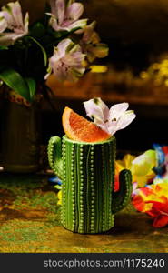 Fresh tropical cocktail with red orange. Alcoholic, non-alcoholic drink-beverage at the bar.