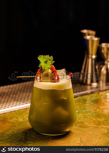 Fresh tropical cocktail with vegetables. Alcoholic, non-alcoholic drink-beverage at the bar.