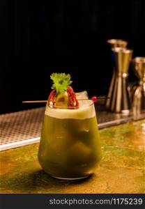 Fresh tropical cocktail with vegetables. Alcoholic, non-alcoholic drink-beverage at the bar.