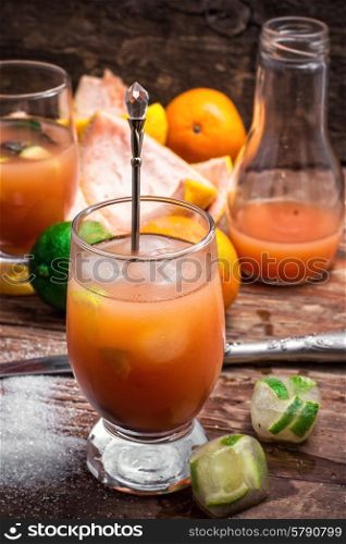 fresh tropical fruit juices. glass with drink of freshly squeezed tropical fruit with pulp.Selective focus.Photo tinted.