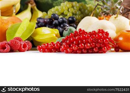 Fresh tropical fruits harvest pile isolated on white background with copy space for text. Fresh fruits pile on white