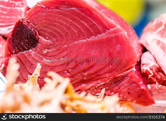 Fresh tuna fish on cooled market display