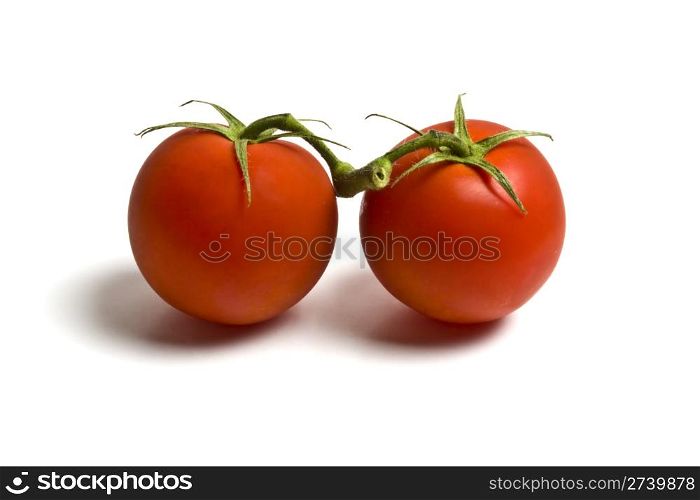 Fresh two tomatoes isolated on white background