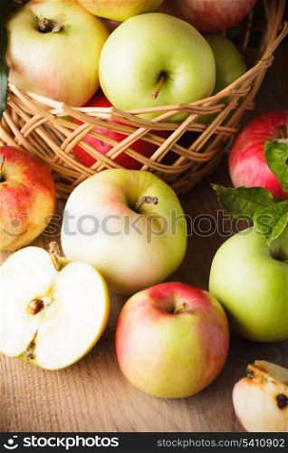 Fresh various apples closeup on wooden table
